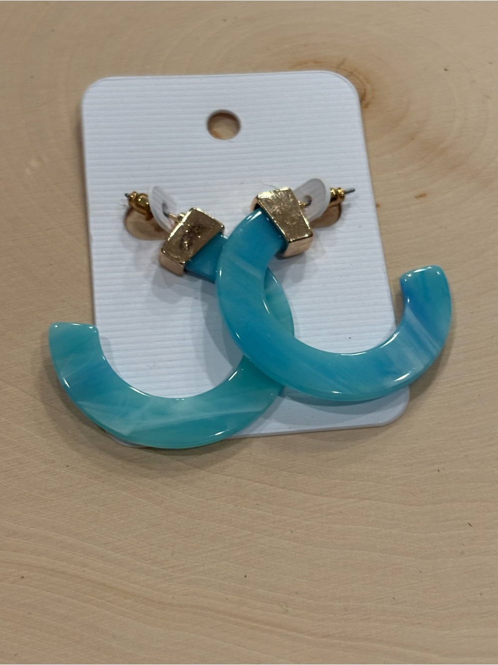 Light blue acrylic hoop earrings new on card unbranded